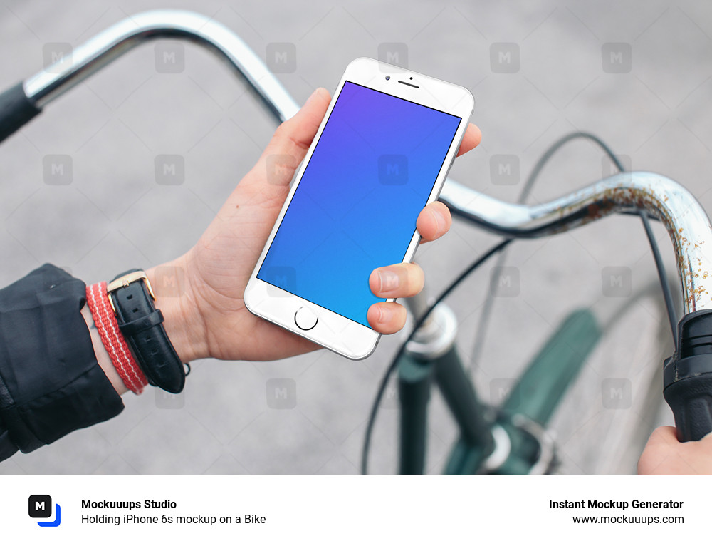 Holding iPhone 6s mockup on a Bike