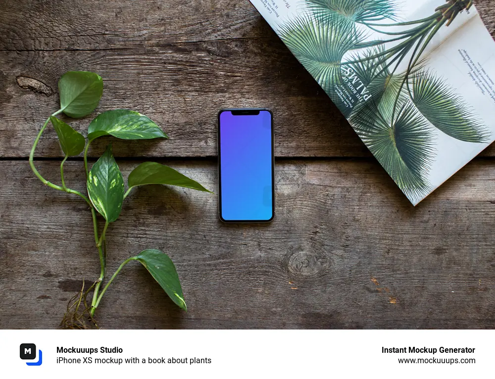 iPhone XS mockup with a book about plants - Mockuuups Studio