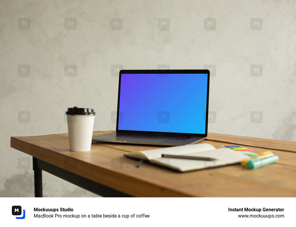 MacBook Pro mockup on a table beside a cup of coffee