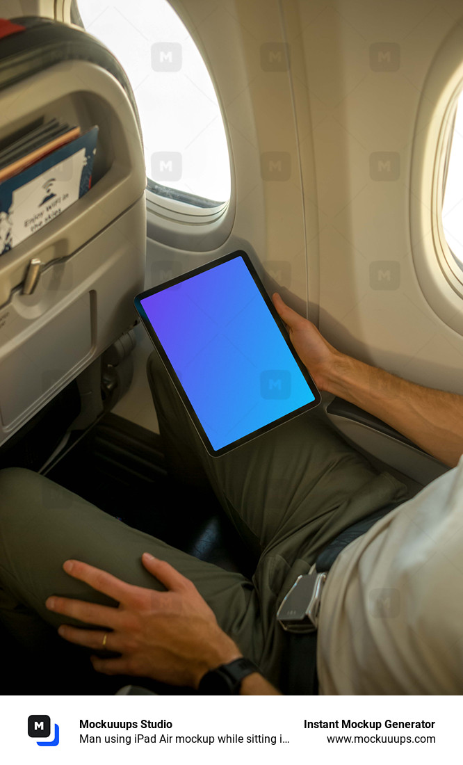 Man using iPad Air mockup while sitting in airplane