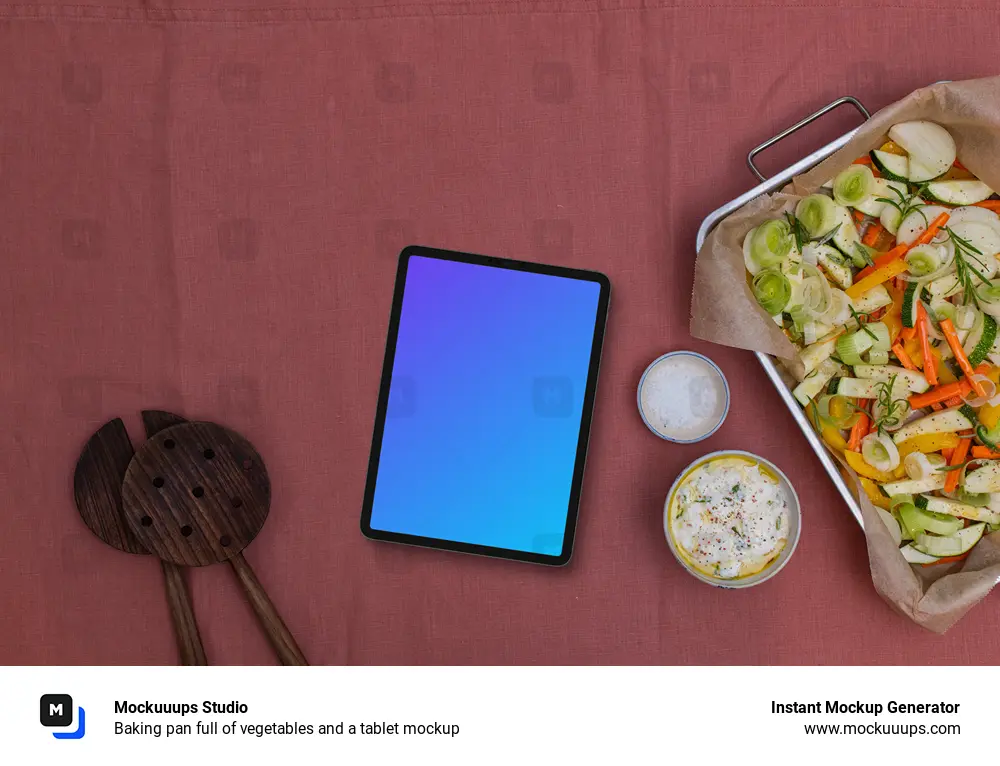 Baking pan full of vegetables and a tablet mockup