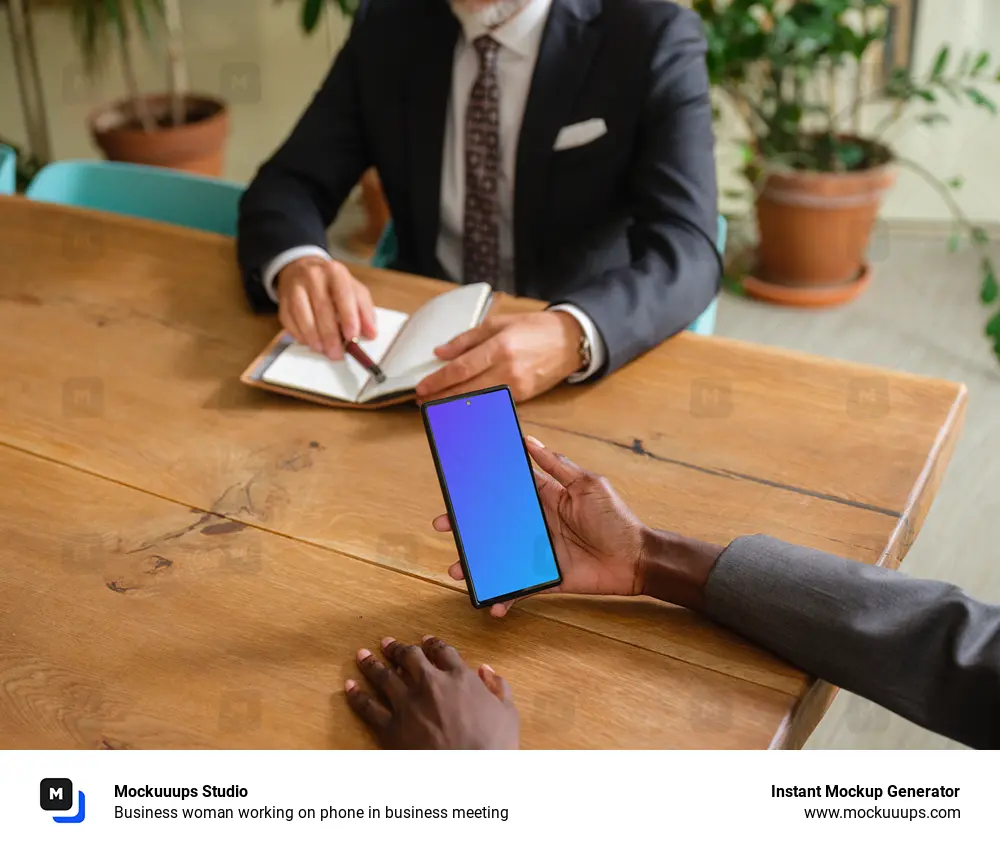 Business woman working on phone in business meeting