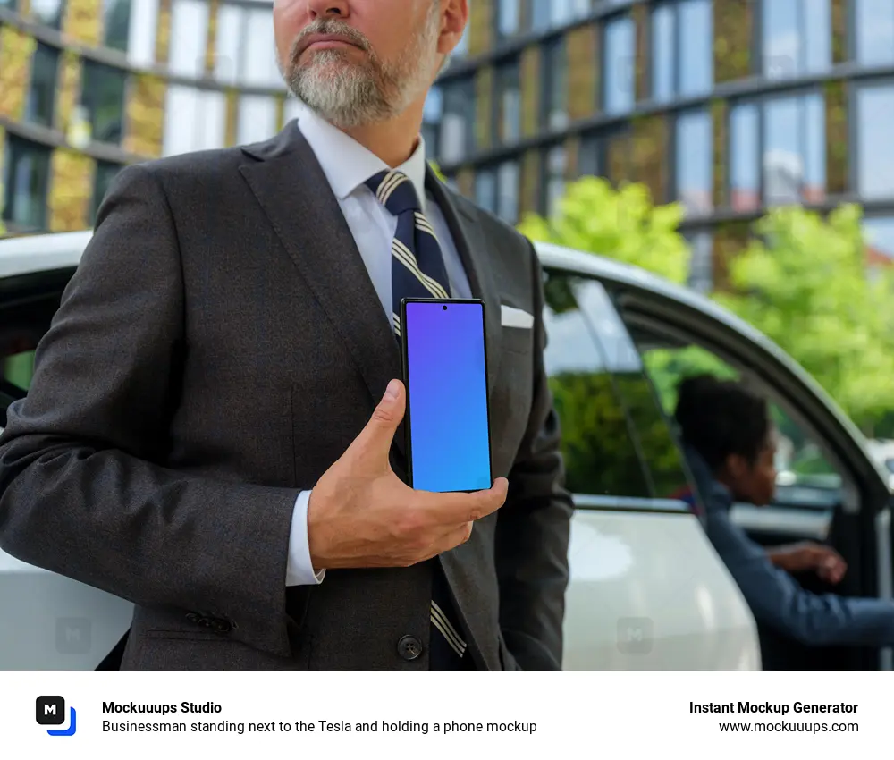 Businessman standing next to the Tesla and holding a phone mockup