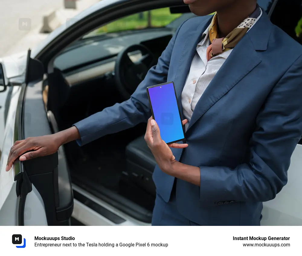 Entrepreneur next to the Tesla holding a Google Pixel 6 mockup