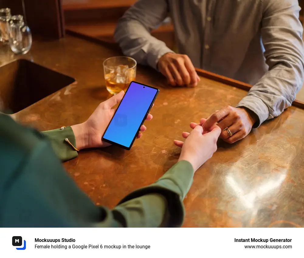 Female holding a Google Pixel 6 mockup in the lounge