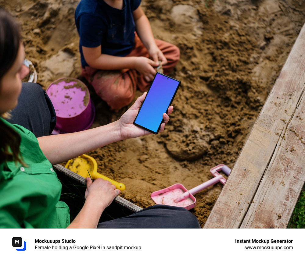 Female holding a Google Pixel in sandpit mockup