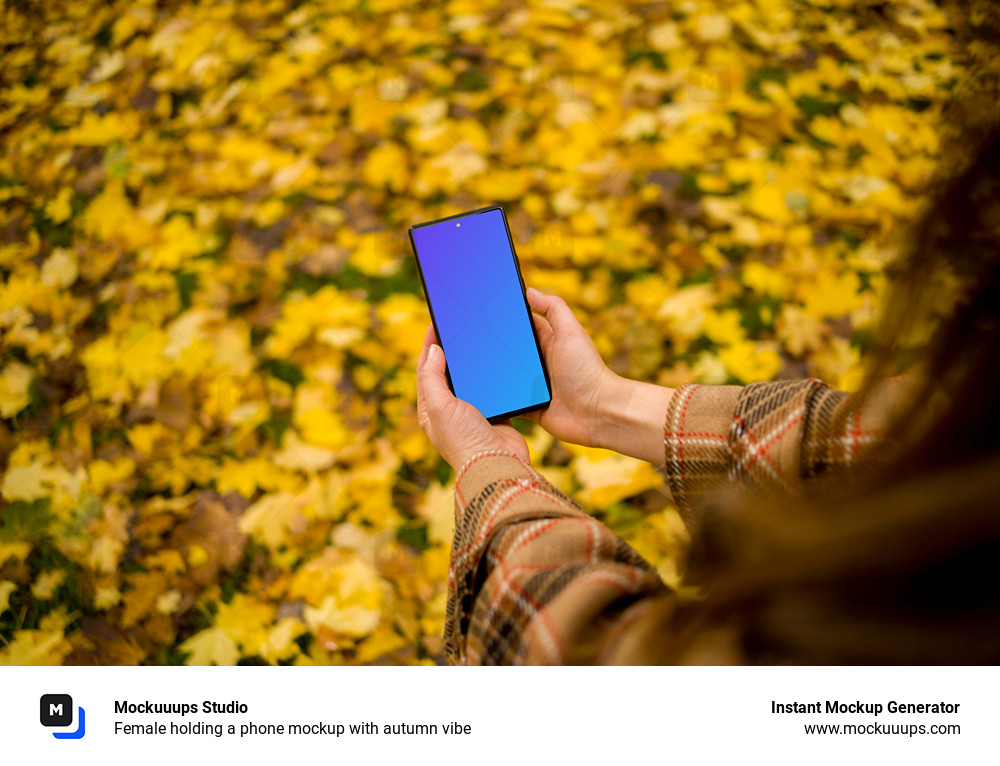 Female holding a phone mockup with autumn vibe