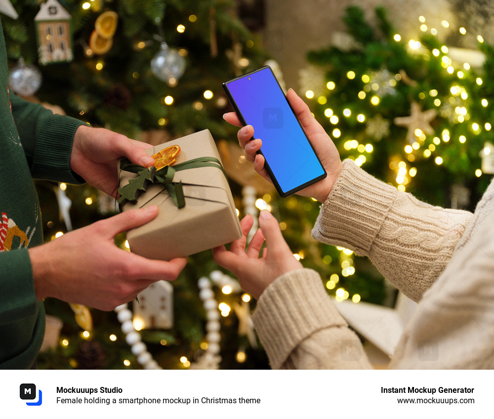 Female holding a smartphone mockup in Christmas theme