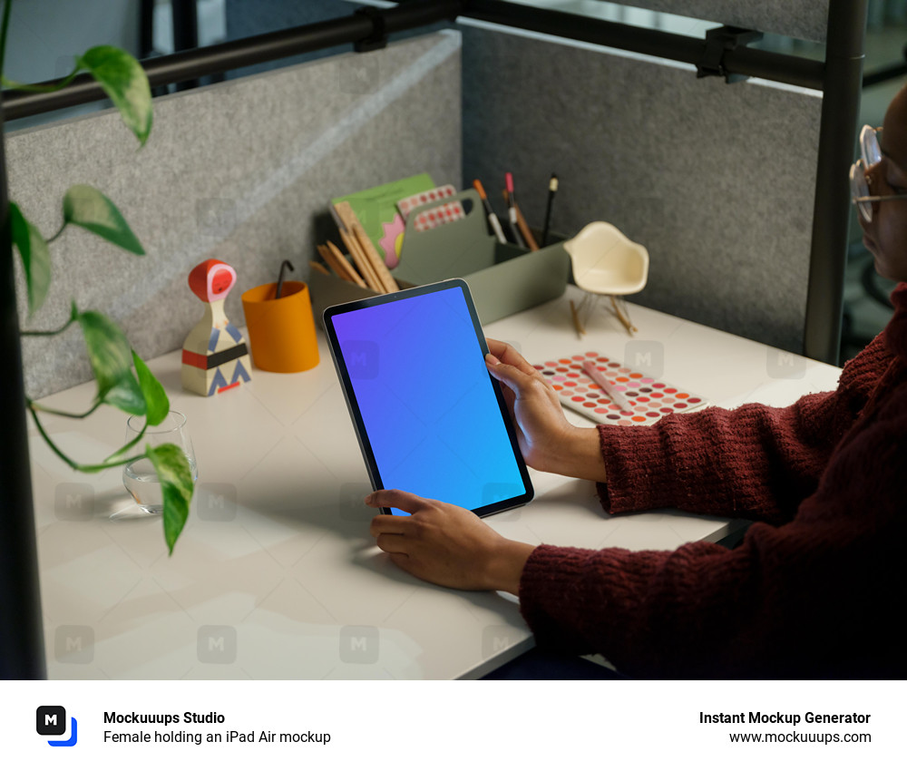 Female holding an iPad Air mockup