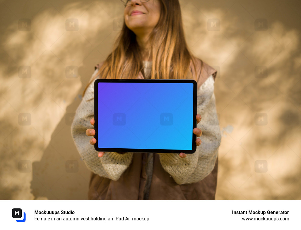 Female in an autumn vest holding an iPad Air mockup