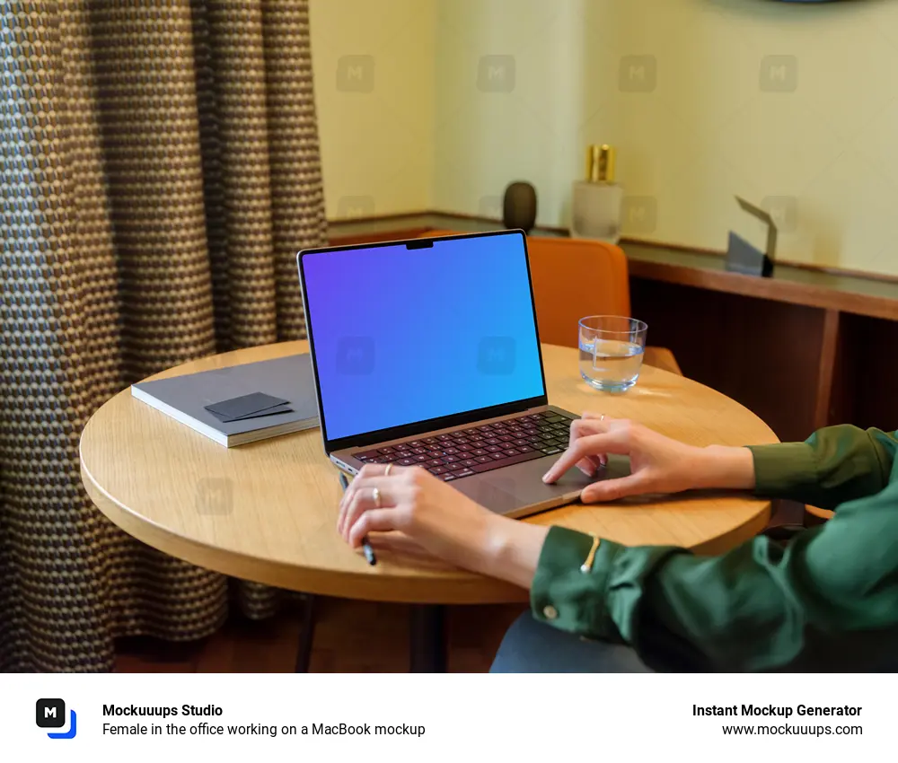 Female in the office working on a MacBook mockup