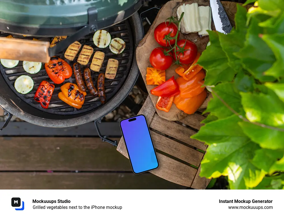 Grilled vegetables next to the iPhone mockup