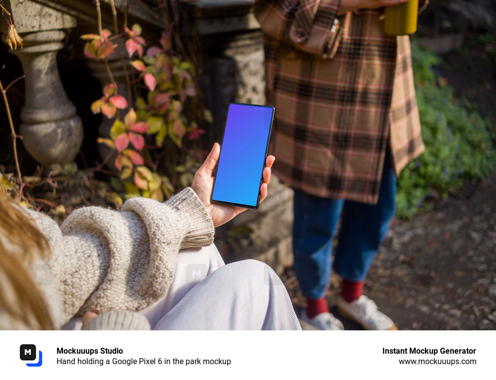 Hand holding a Google Pixel 6 in the park mockup