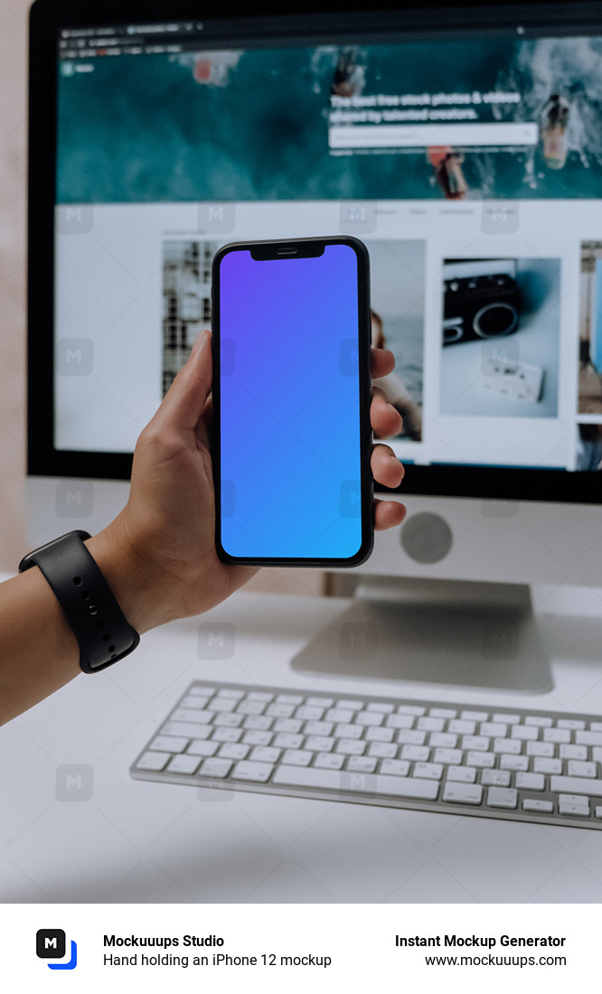 Hand holding an iPhone 12 mockup