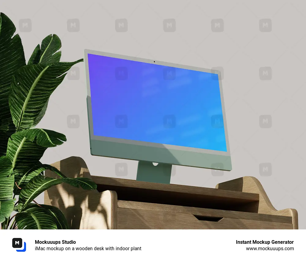 iMac mockup on a wooden desk with indoor plant