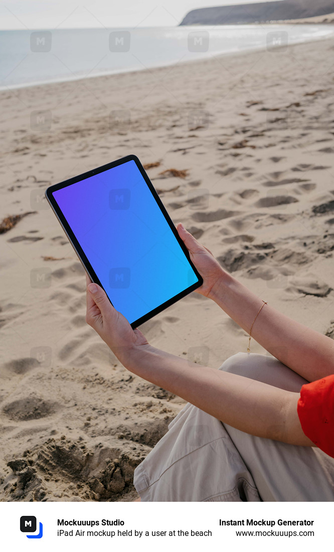 iPad Air mockup held by a user at the beach