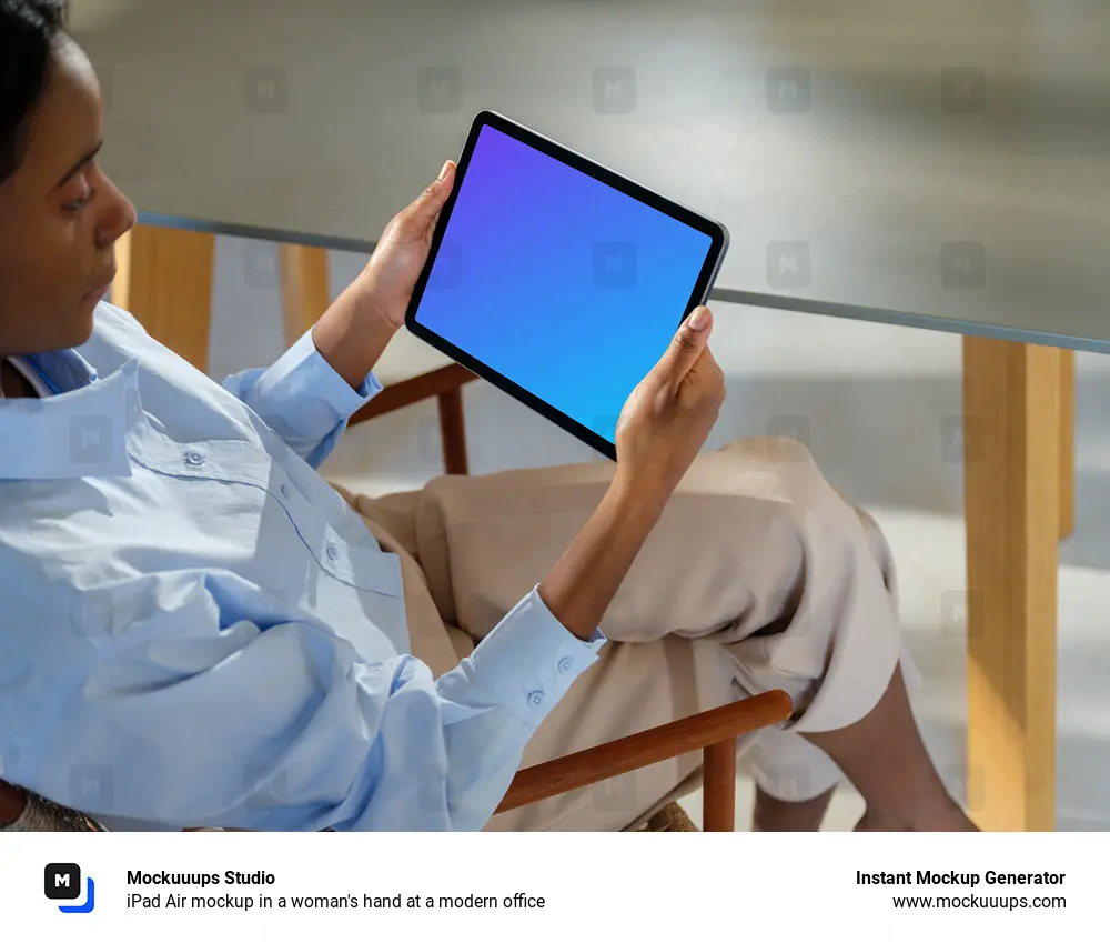iPad Air mockup in a woman's hand at a modern office