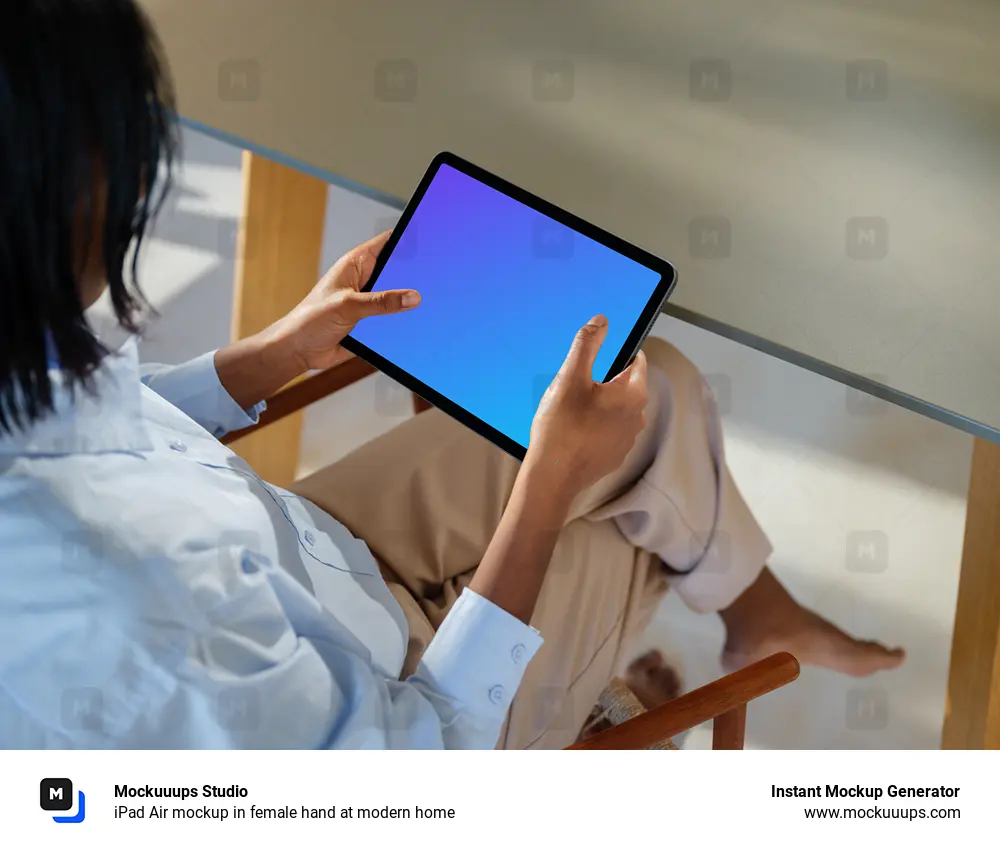 iPad Air mockup in female hand at modern home