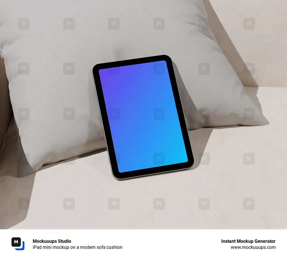 iPad mini mockup on a modern sofa cushion