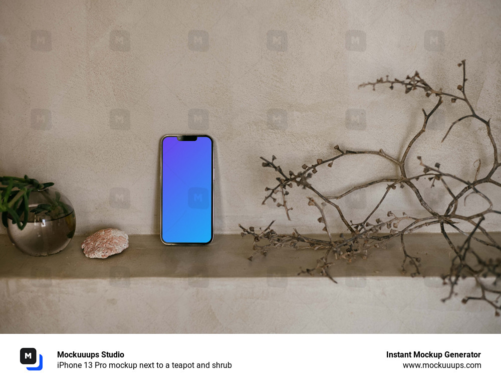 iPhone 13 Pro mockup next to a teapot and shrub