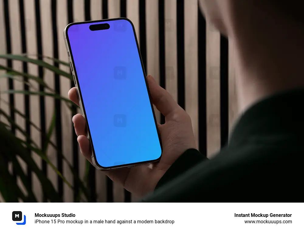 iPhone 15 Pro mockup in a male hand against a modern backdrop