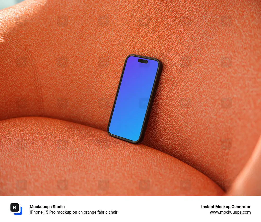 iPhone 15 Pro mockup on an orange fabric chair