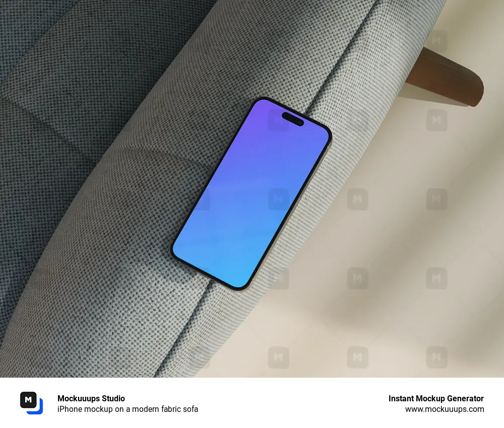 iPhone mockup on a modern fabric sofa