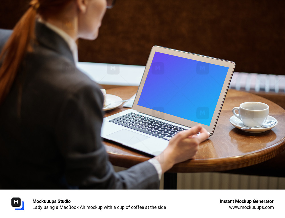 Lady using a MacBook Air mockup with a cup of coffee at the side