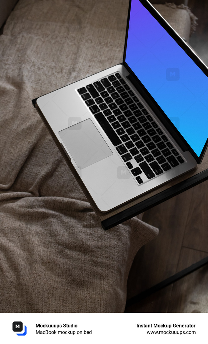 MacBook mockup on bed