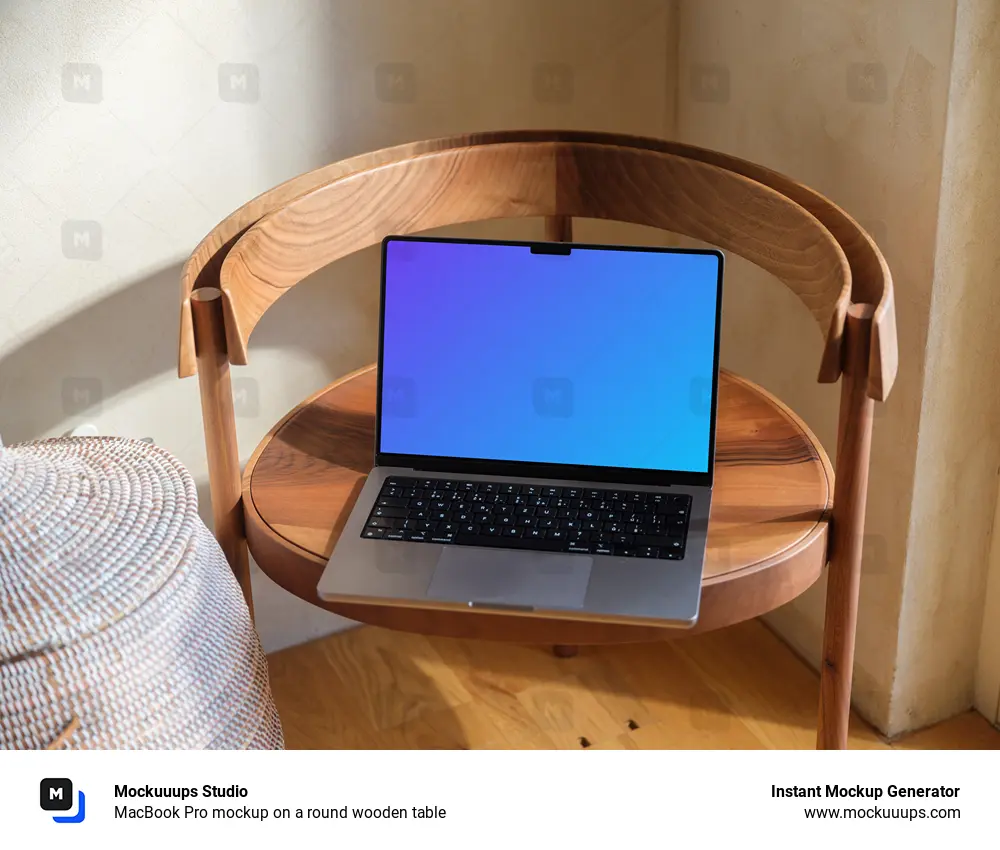 MacBook Pro mockup on a round wooden table