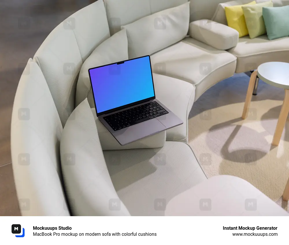 MacBook Pro mockup on modern sofa with colorful cushions