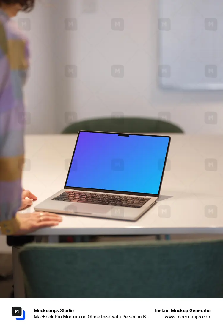 MacBook Pro Mockup on Office Desk with Person in Background