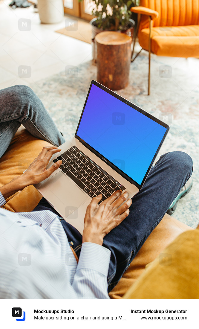 Male user sitting on a chair and using a MacBook Pro mockup