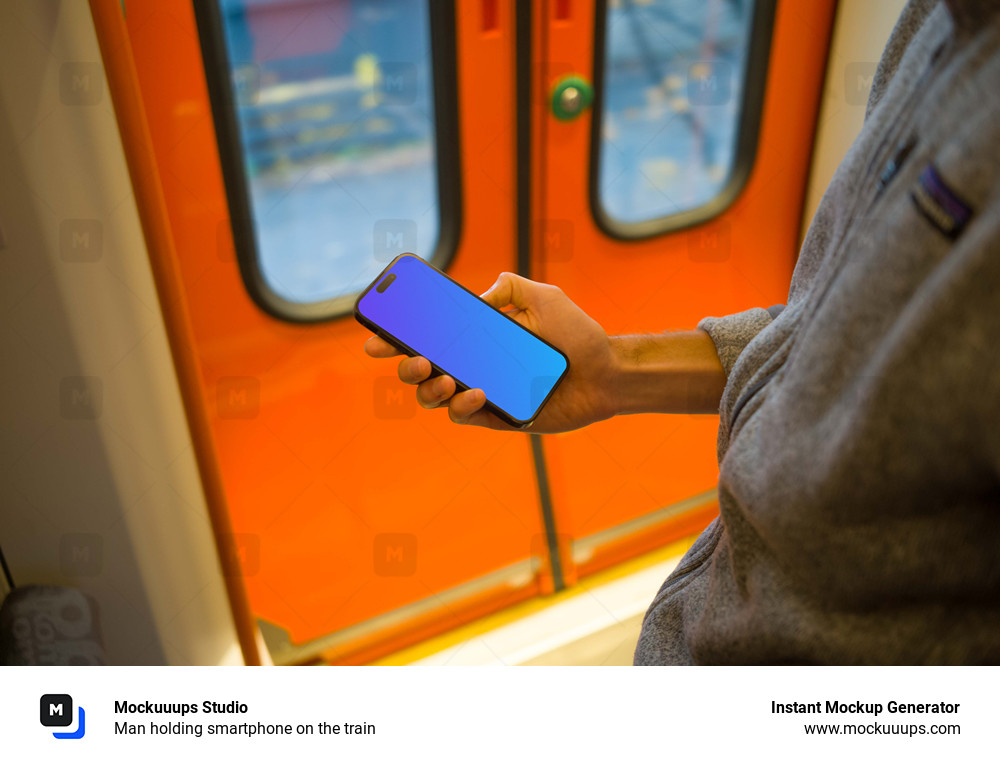 Man holding smartphone on the train