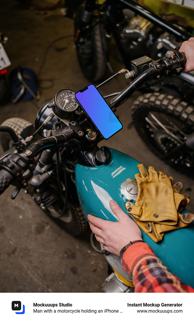 Man with a motorcycle holding an iPhone 13 Mockup
