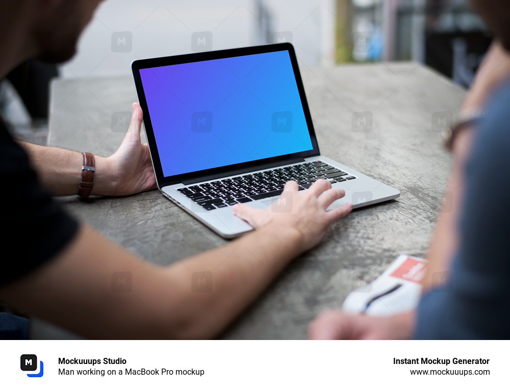 Man working on a MacBook Pro mockup