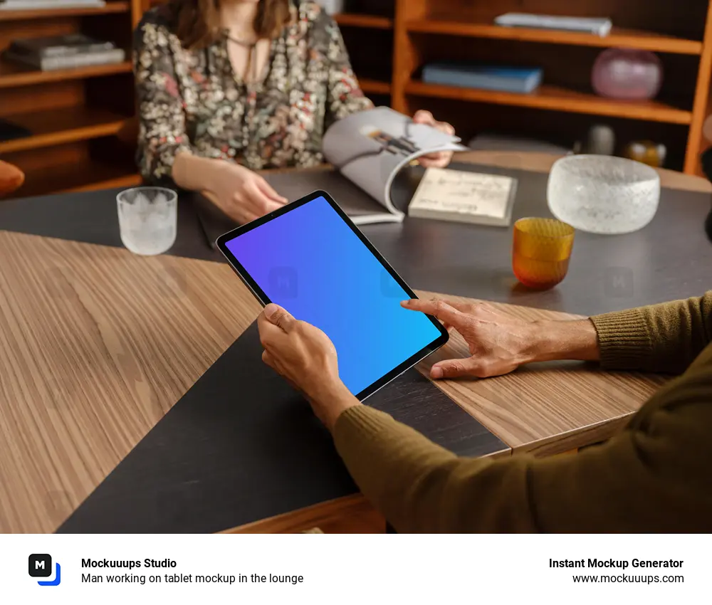 Man working on tablet mockup in the lounge