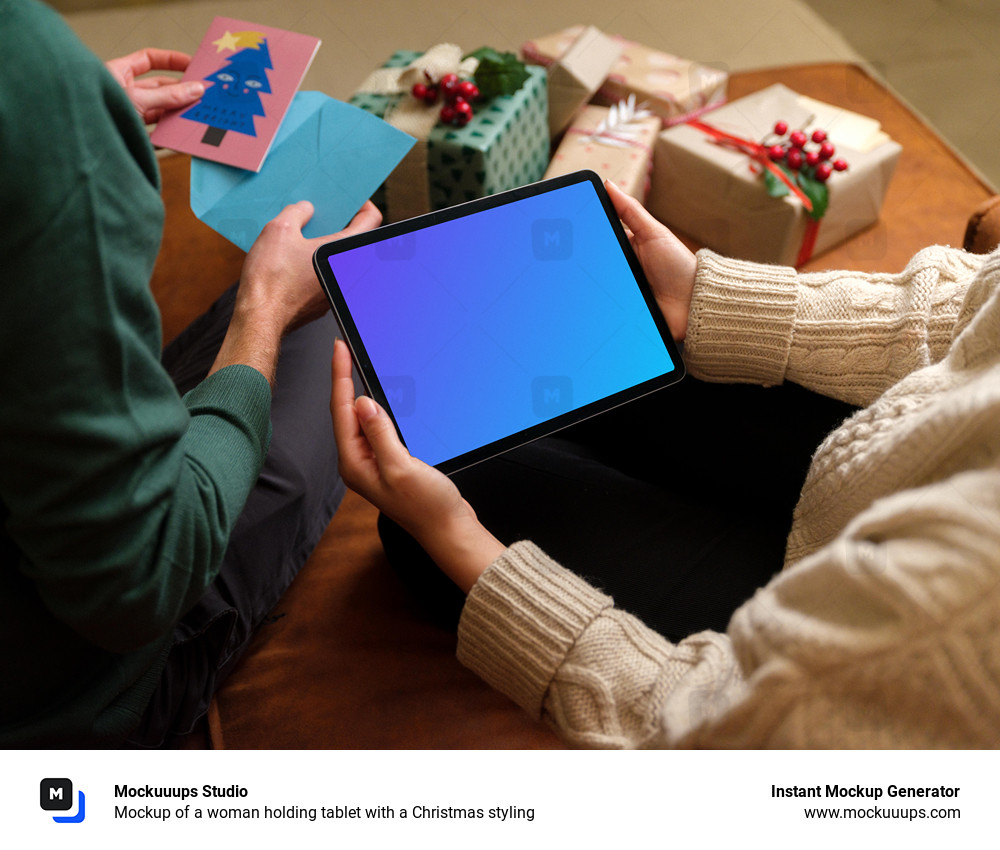 Mockup of a woman holding tablet with a Christmas styling