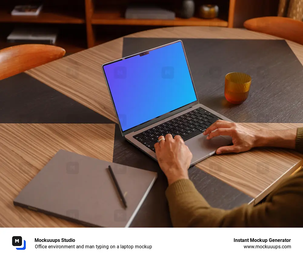 Office environment and man typing on a laptop mockup