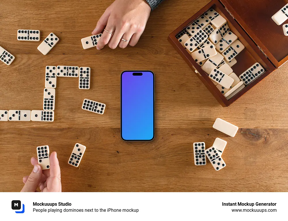 People playing dominoes next to the iPhone mockup