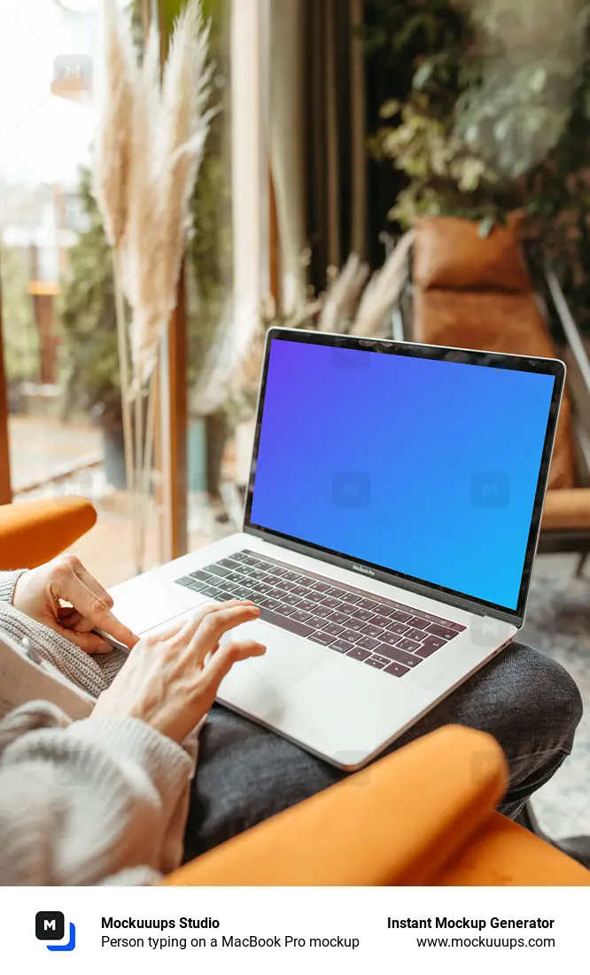 Person typing on a MacBook Pro mockup