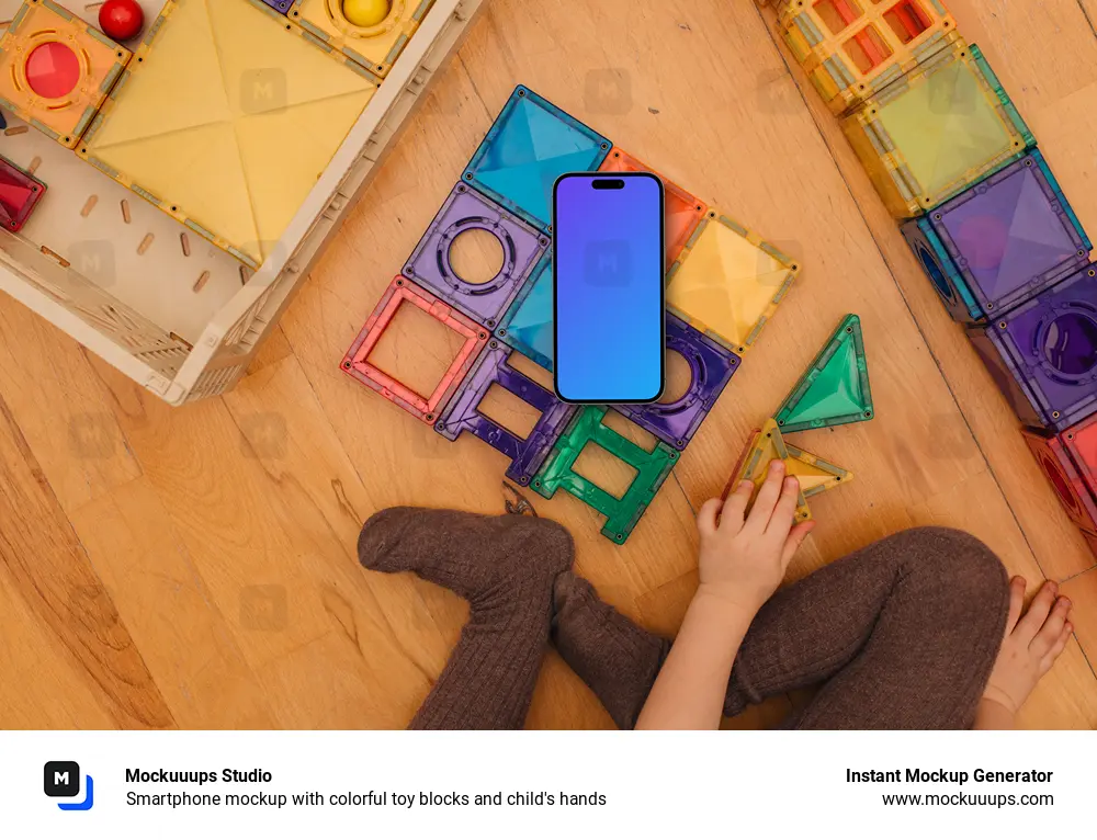 Smartphone mockup with colorful toy blocks and child's hands