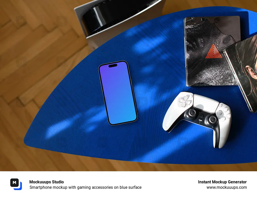 Smartphone mockup with gaming accessories on blue surface