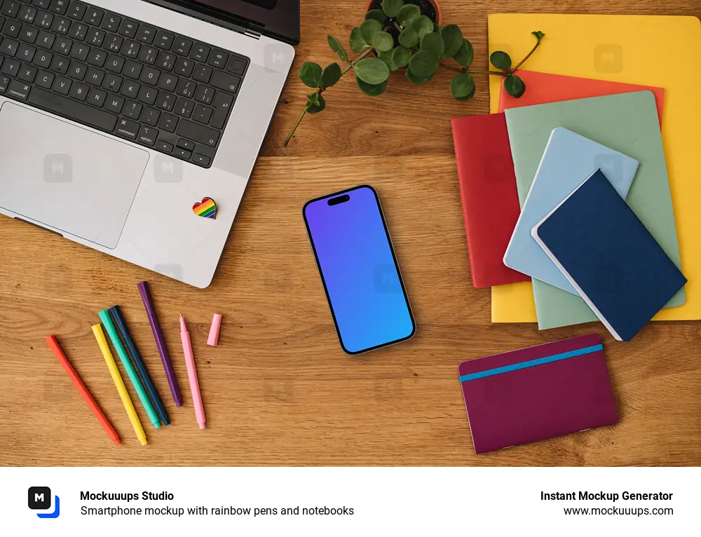 Smartphone mockup with rainbow pens and notebooks