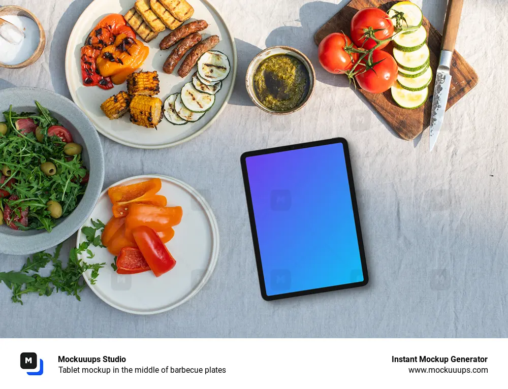 Tablet mockup in the middle of barbecue plates