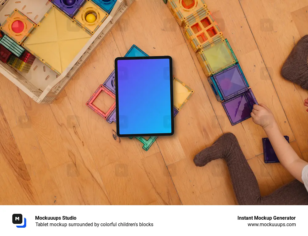 Tablet mockup surrounded by colorful children's blocks