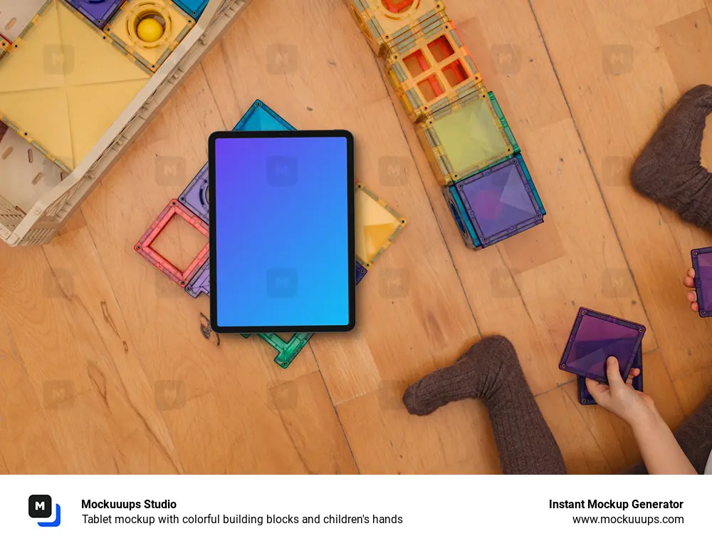 Tablet mockup with colorful building blocks and children's hands