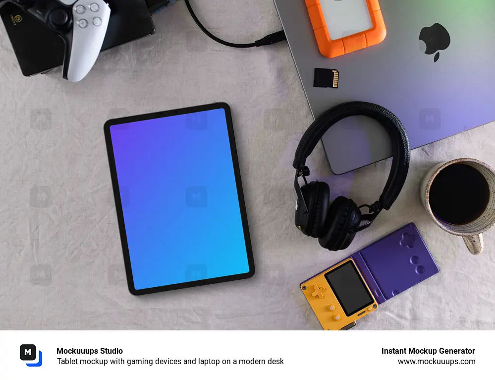 Tablet mockup with gaming devices and laptop on a modern desk