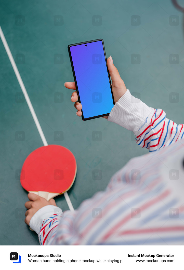 Woman hand holding a phone mockup while playing ping-pong