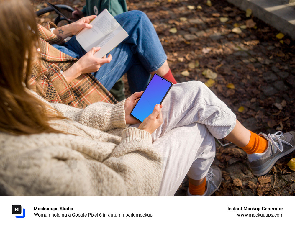 Woman holding a Google Pixel 6 in autumn park mockup